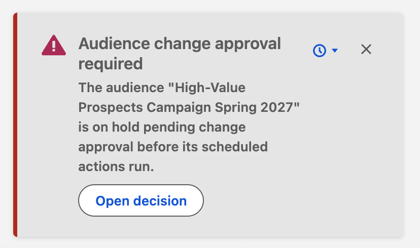 Error notification explaining that a named audience is on hold for change approval, with snooze, dismiss, and Open decision controls